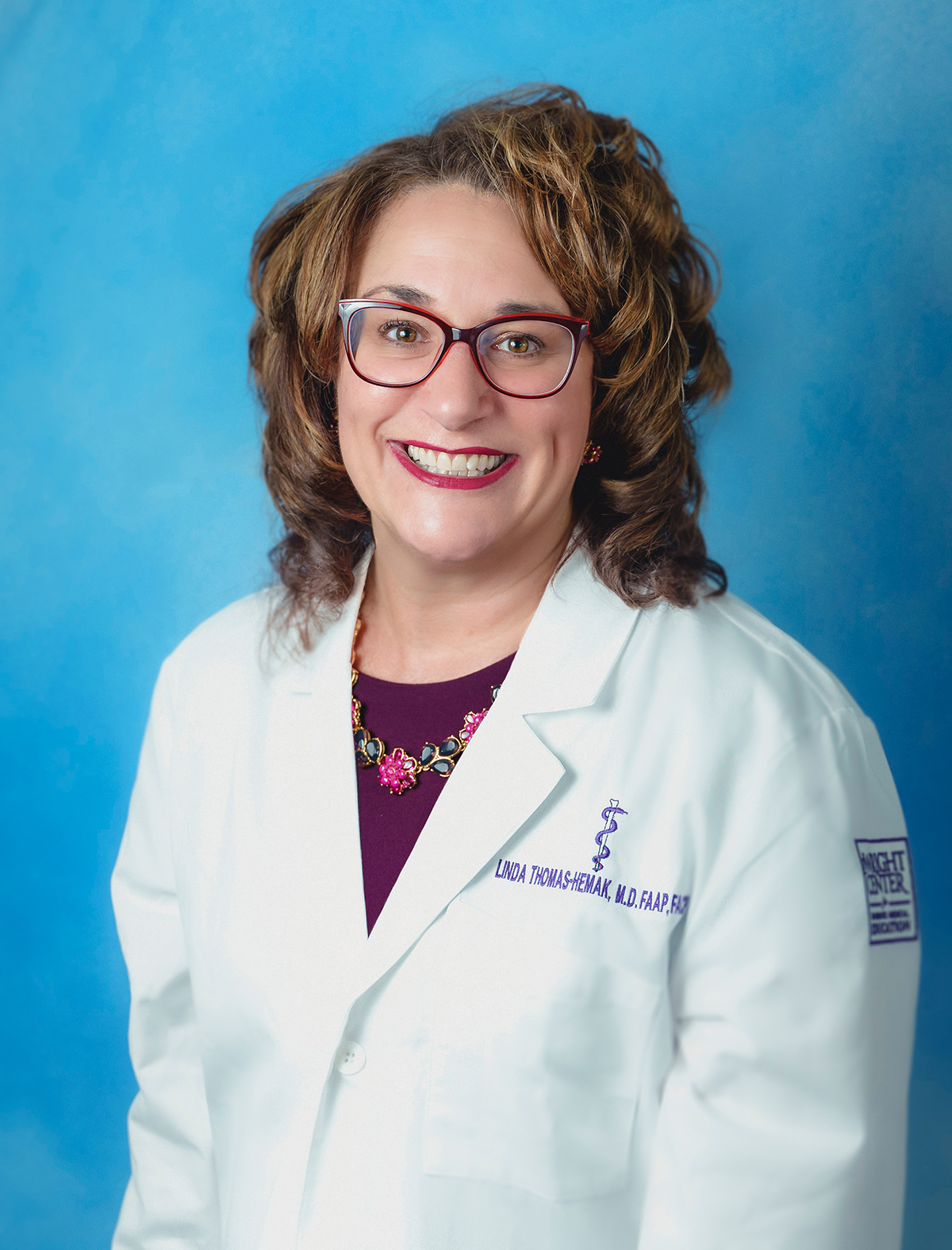 Dr. Linda Thomas-Hemak in white coat